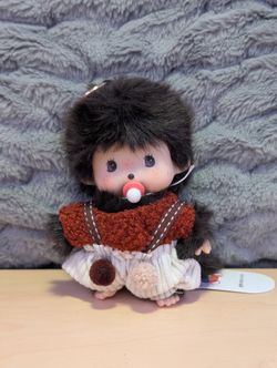 Cute monchichi plush doll with pacifier and knitted outfit