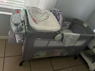 5 in 1 baby crib, play pen, changing station with mosquito net and lower storage area with zipper