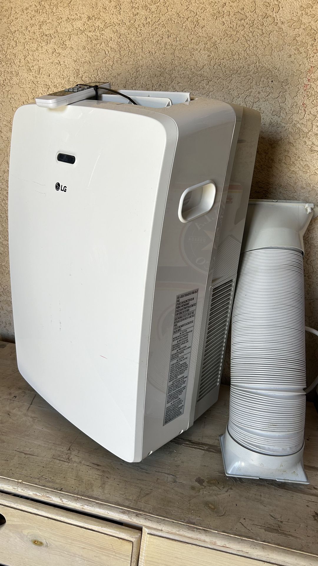 LG 10.200 Btu Air Conditioner Like New Comes With Remote Control And Attachments