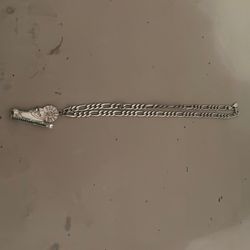 The chain is real it’s silver the little pendant the little ring on it is not real silver. I put it on there because the real silver that was on it br