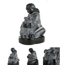 Sculpture Of Girl And Husky