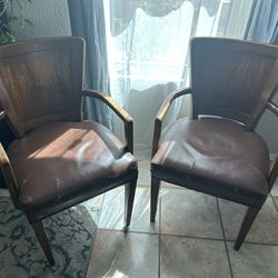 Two Leather And Wooden Chairs