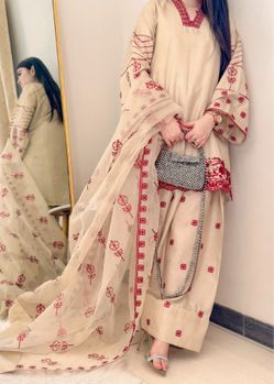 This traditional South Asian outfit is called a Farshi Shalwar Suit.