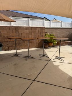 Cocktail Table.   30’round 42’ Tall