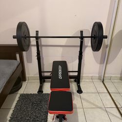 Bench press machine with weights and bar