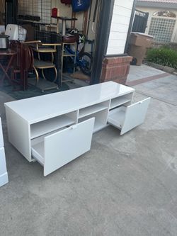 63 inches long, 18 inches tall ikea tv stand very good