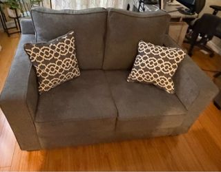 2 grey couches. One large 3 seater & one 2 seater