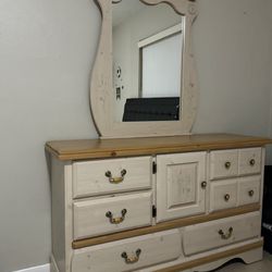 Two nightstands and dresser with mirror. 