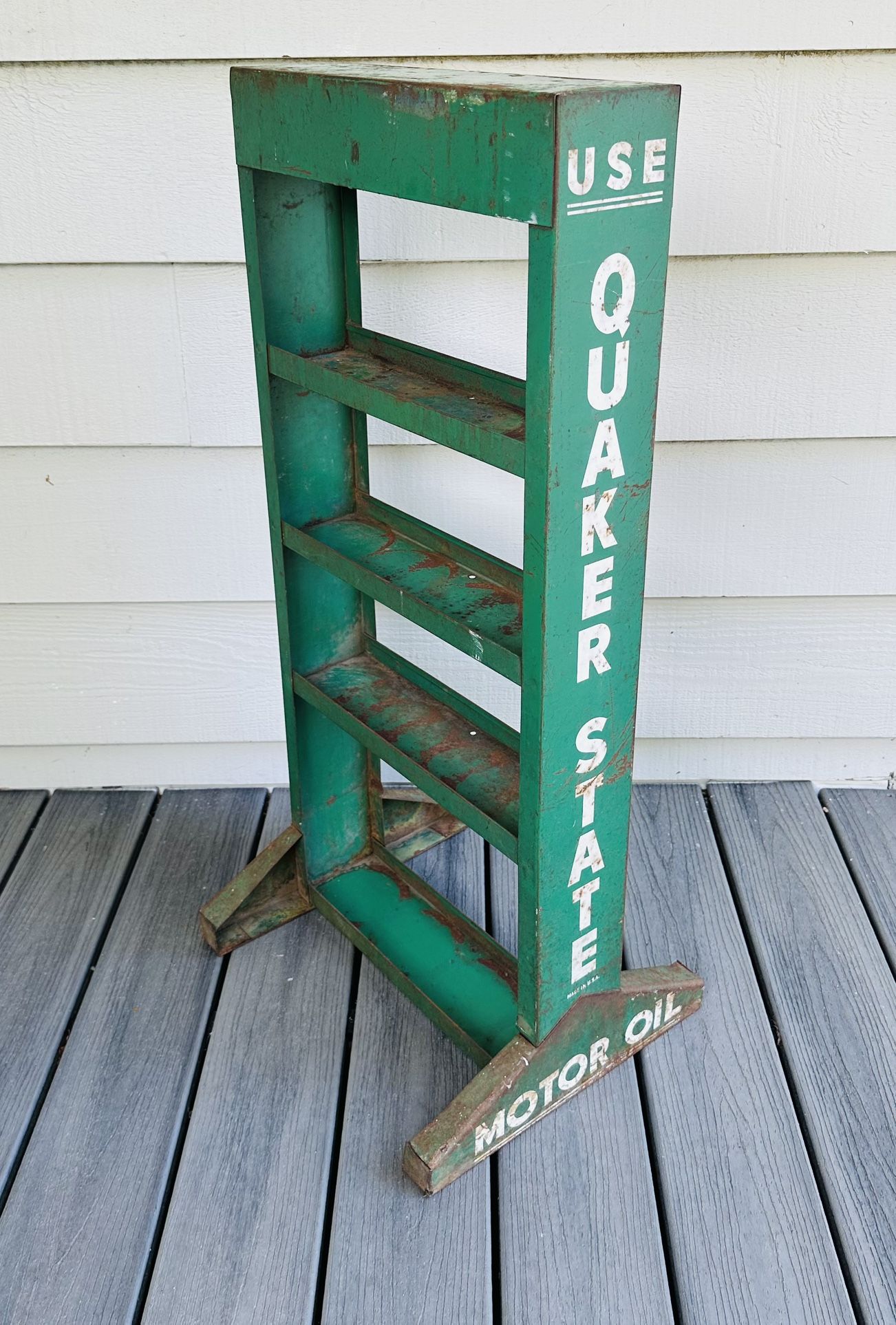 Vintage Quaker State Motor Oil standing display shelf 35 1/2” tall. 16 1/2” length. 4 1/2” wide body. 14” wide on the legs bottom area .