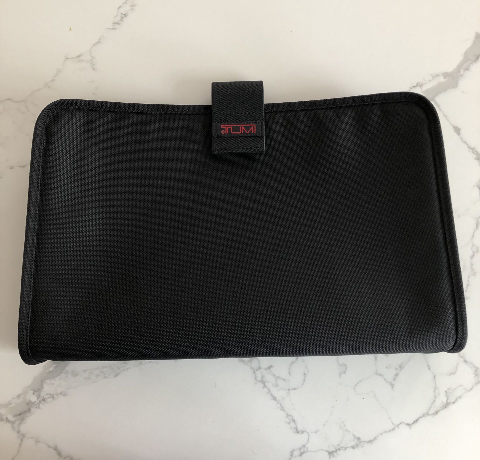 TUMI Black Ballistic Nylon Padded Laptop Tablet Protective Sleeve Case Fits 15". Never used. Measurements are 15” x 9”. Velcro close. Smoke free home.