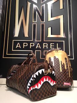 sprayground sharks in paris duffle and drip backpack