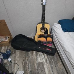 Rouge Acoustic Guitar With Books, Picks And Tuner