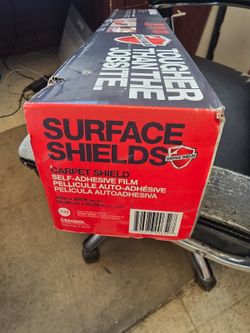 Carpet shield adhesive