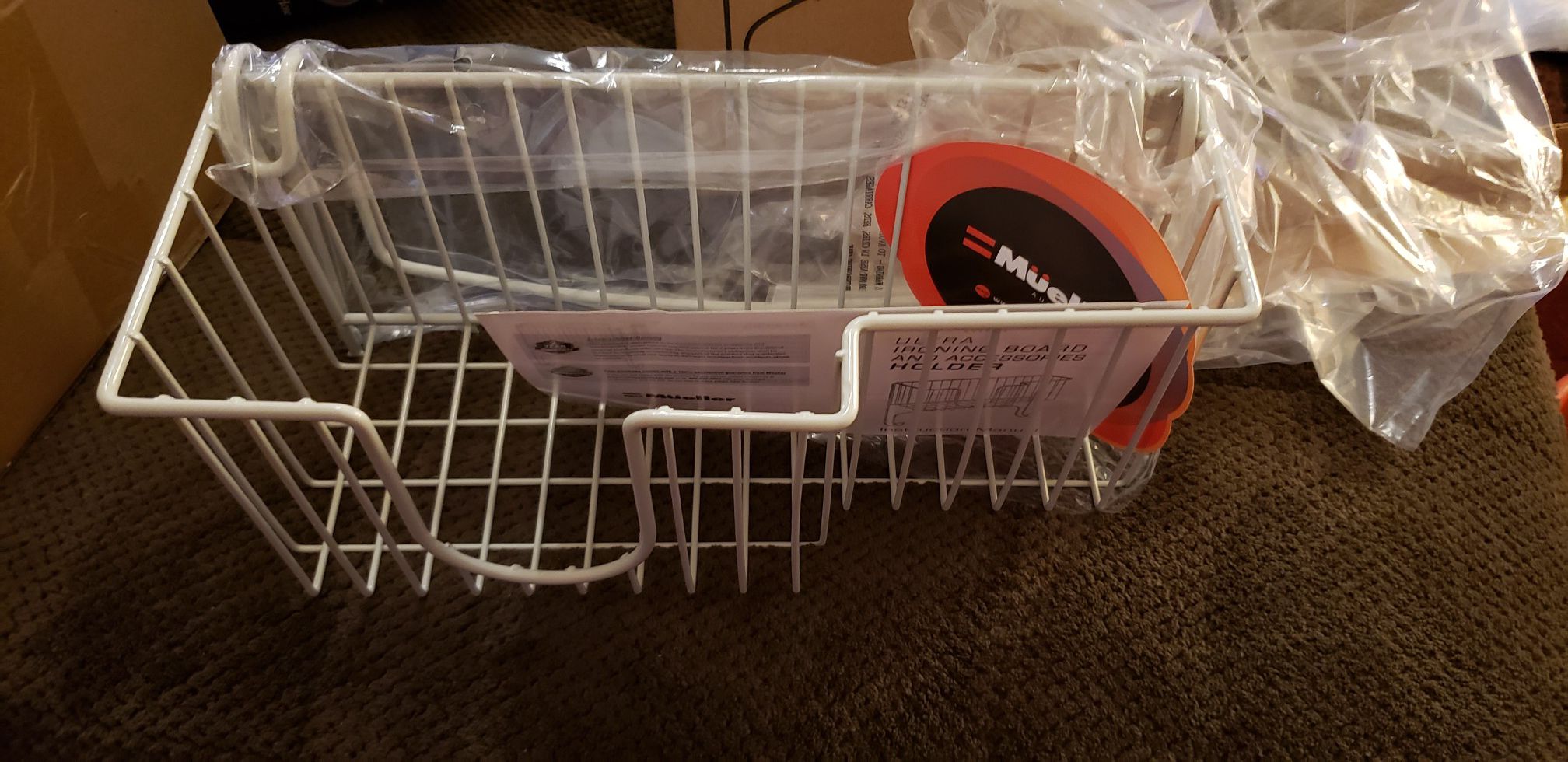 Ironing board holder with storage