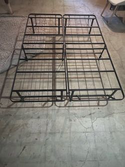 Full size mattress with metal bed frame.