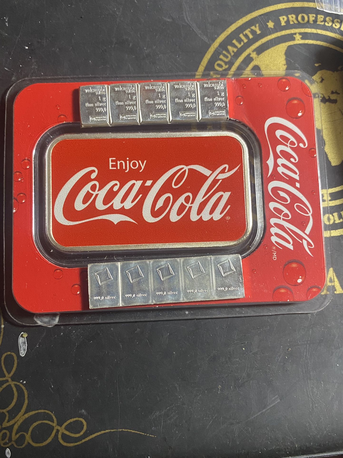 Coca Cola 1 ounce silver bar with 11 1 g bars, five of them are connee connected