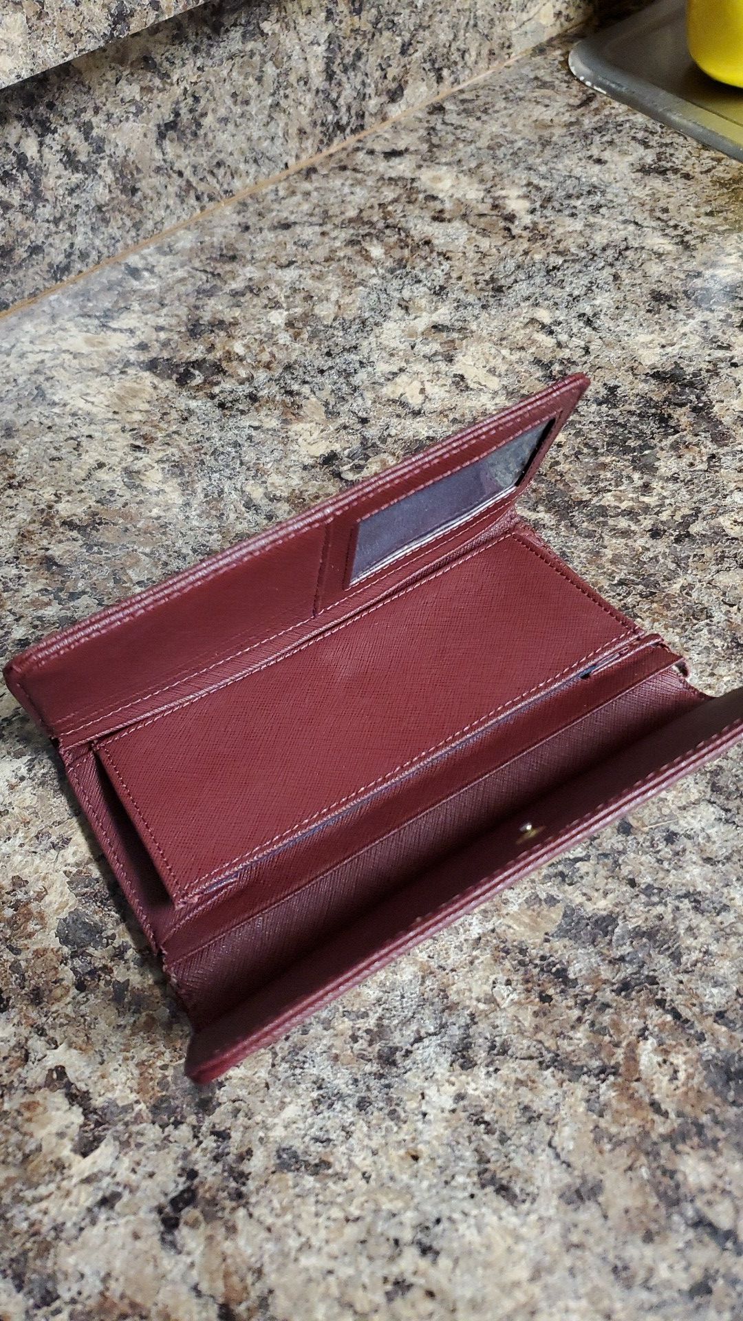 Maroon Tommy Hilfiger wallet.