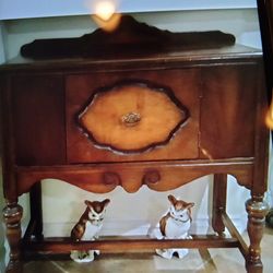 Old cabinet has wooden Wheels