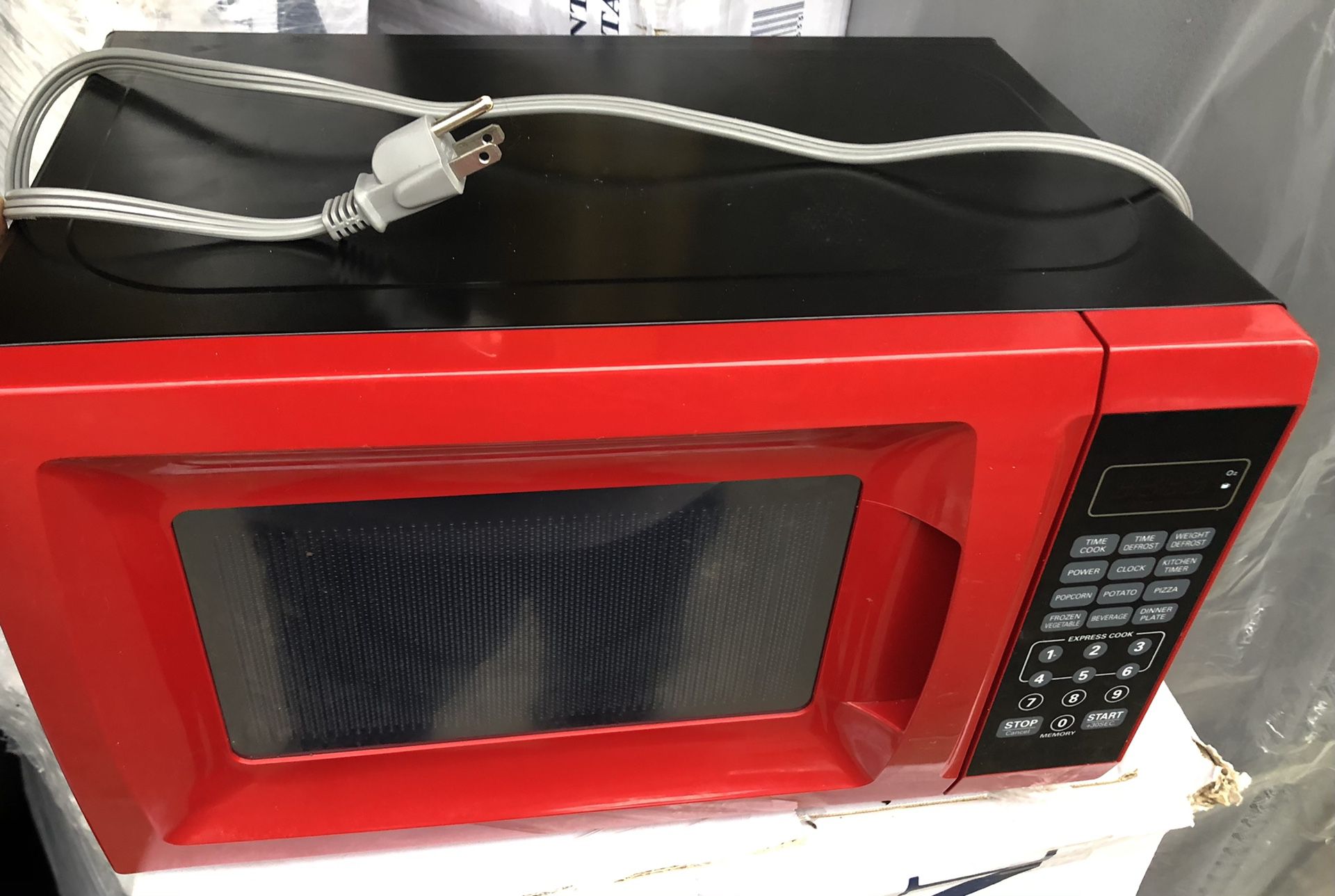 like new red 0.7 cu ft 700W microwave