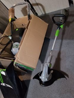 Earthwise 20 In 24 Volt Cordless Lawn Mower With 20 Amp Hr Battery 60120. Also Included Earthwise Electric Weed Eater Electric Cord. for Sale in
