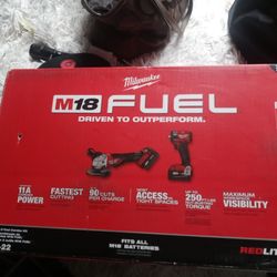 Milwaukee    3/8 Impact And Grinder Cordless Comes With Batteries And Charger And Bag