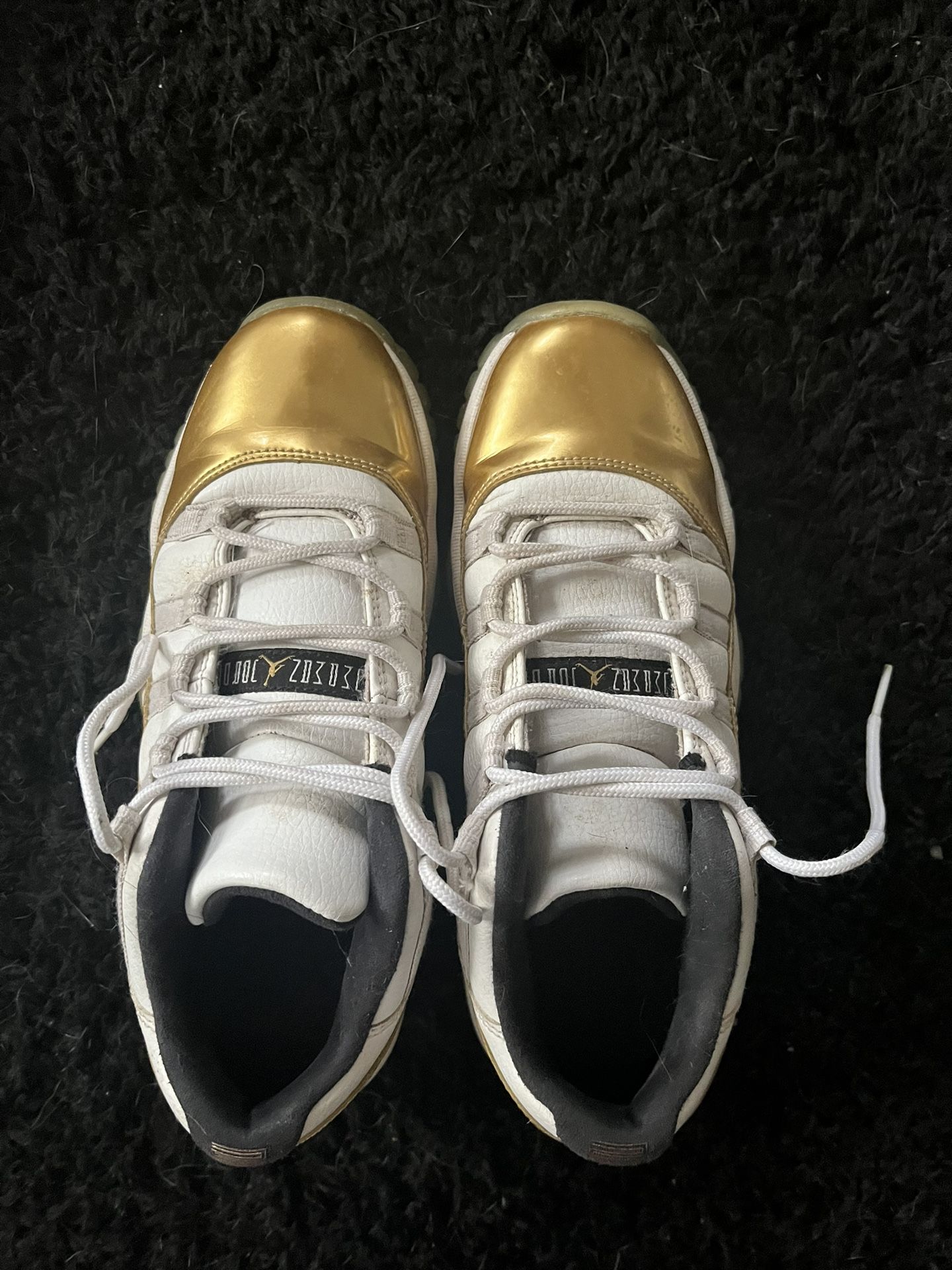 Gold Air Jordan 11s retro lows (size 6y)