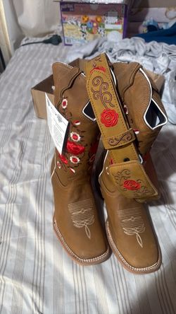 Embroidered cowgirl boots and belt