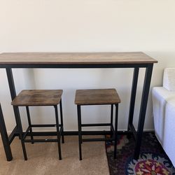 Bar table set with two stools