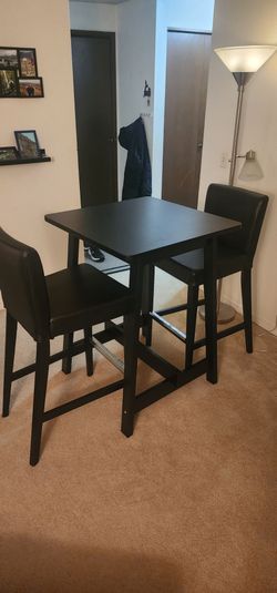 Ikea table with 2 leather barstools