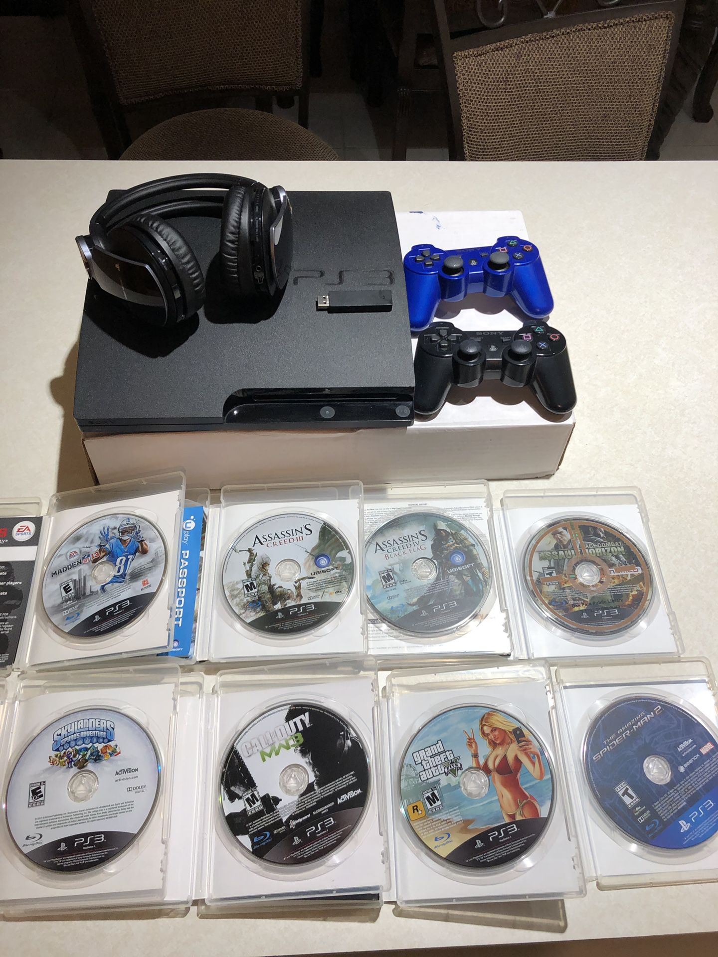 PS3 game counsel w/2 controls ,games and Sony headphone
