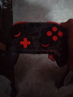 Black and Red Wireless Game Controller