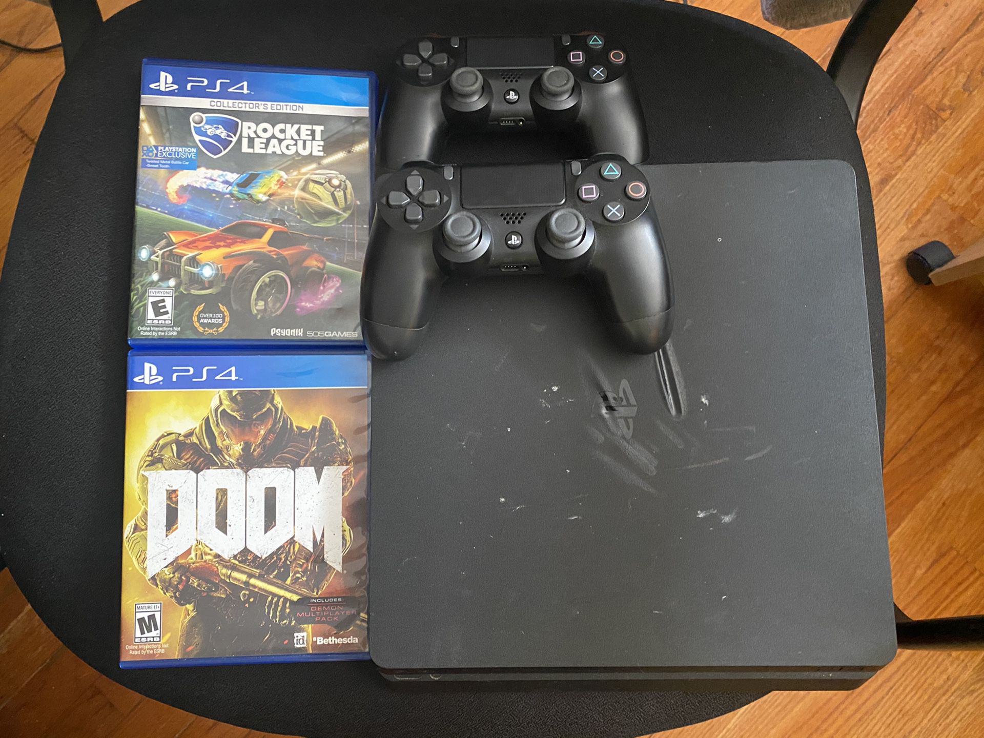 PS4 Slim w/ 2 Controller’s & 2 Games