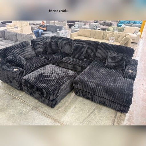 Black corduroy modular sectional sofa with ottoman