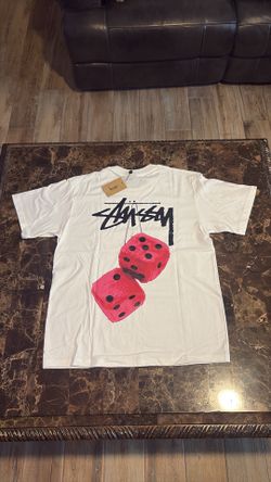 White stussy t-shirt with pink graphi