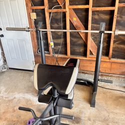 Marcy Weight Bench With 45lb Bar and bar Clips.