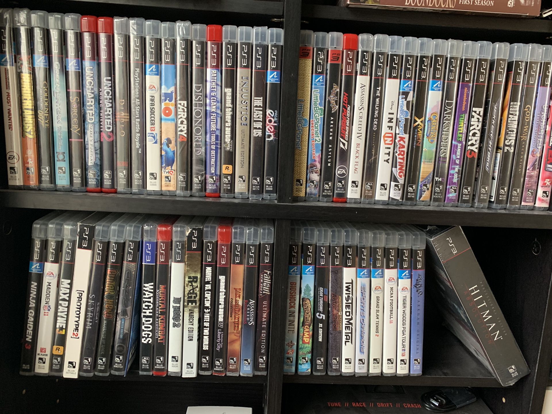 PS3 slim, 3 wireless remotes, motion cam, 65 games!