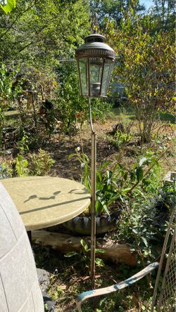 2 lamp post on metal stands