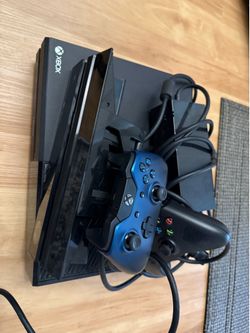 X box with 2 controllers and connect and a game
