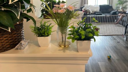 Three potted artificial plants for home decor