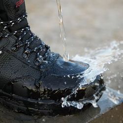 Waterproof Brand new steel toe safety boots.