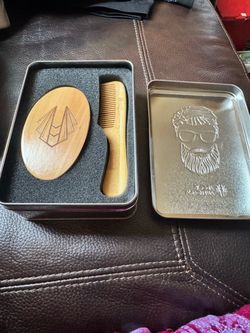 Natural brown wooden beard brush and comb set for precise grooming.