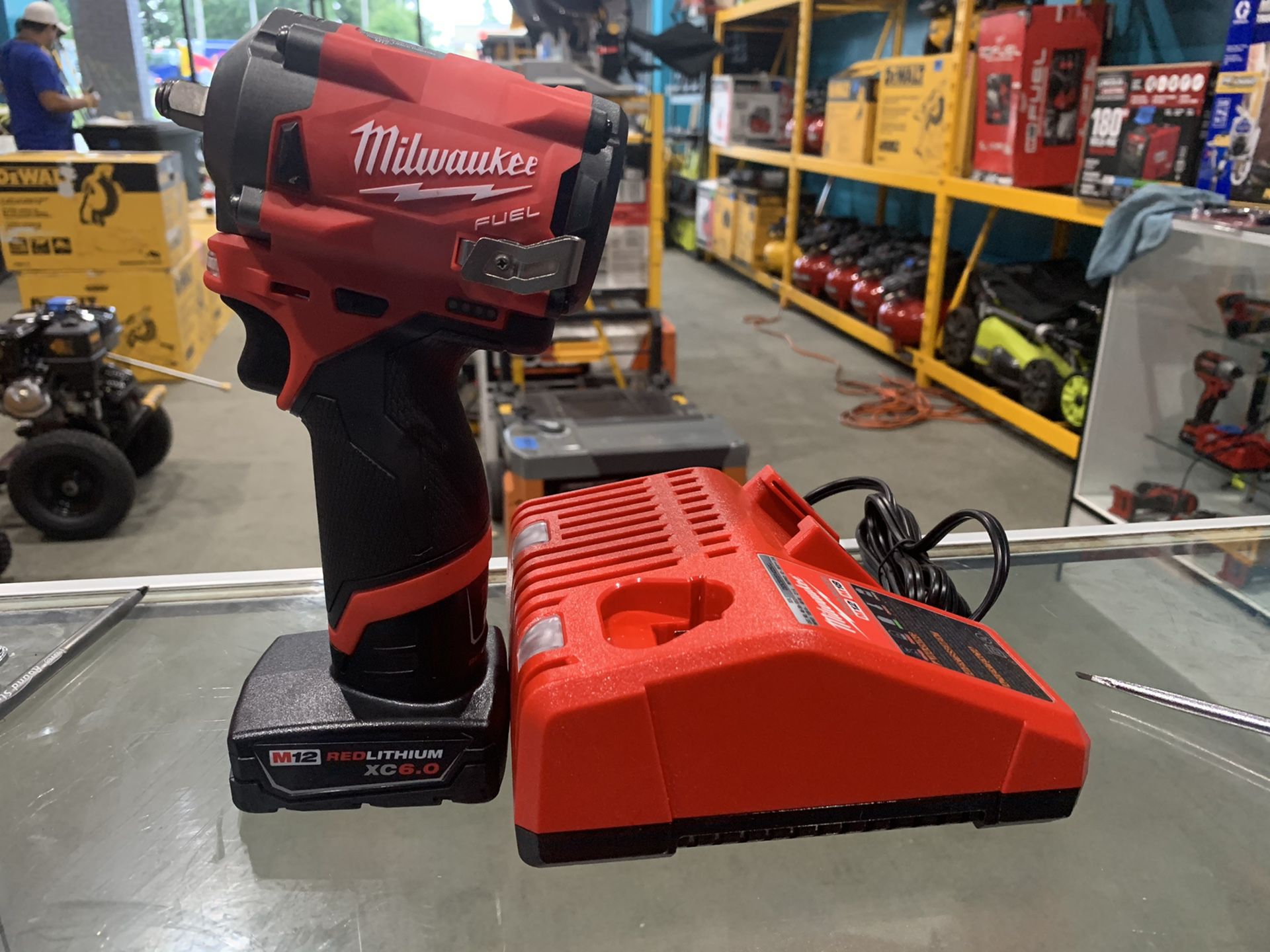 Milwaukee M12 FUEL 12Brushless Cordless Stubby 3/8 in. Impact Wrench kit with 6.0 battery in charger