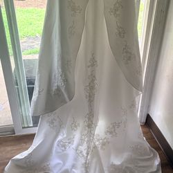 Beautiful beaded wedding dress worn once and put in my closet..