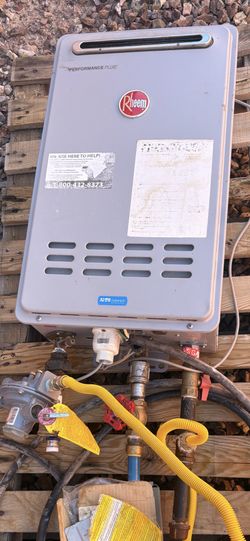 Rheem Outdoor Tankless Hot Water Heater And Regulator