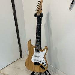 Stratocaster Copy. Full Size 1/2 Way Decent Guitar And Priced Right Plays Surprisingly Well