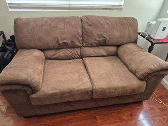 Brown suede loveseat