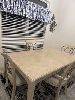 Wooden table with four chairs