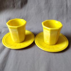 2 yellow Chinese teacups and saucers