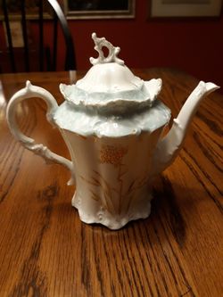 Antique tea pot. Bone china trimmed in gold and aqua.