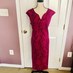 Hot pink dress with black floral print. 